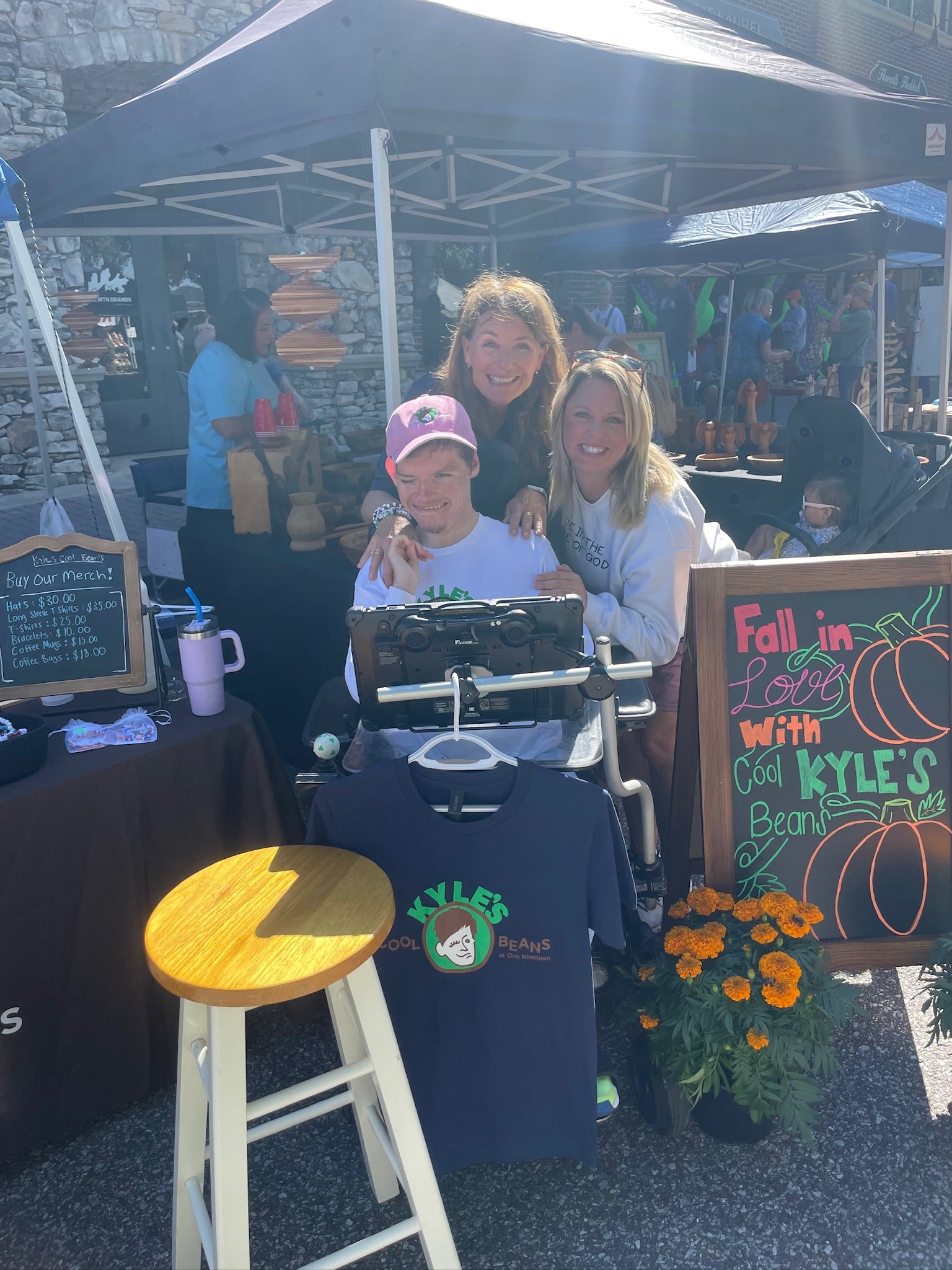 Kyle his mom and a customer at the Coffee cart